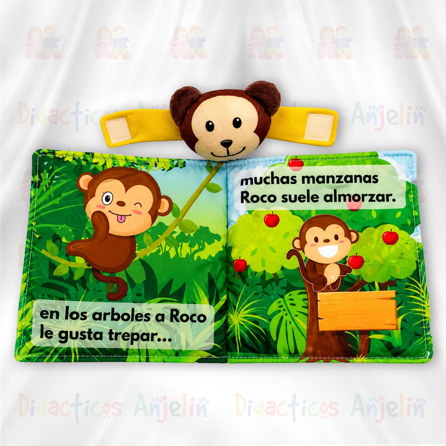 Libro infantil suave y acolchado con ilustraciones coloridas de un mono trepando árboles y disfrutando frutas, ideal para aprendizaje temprano y estimulación cognitiva.