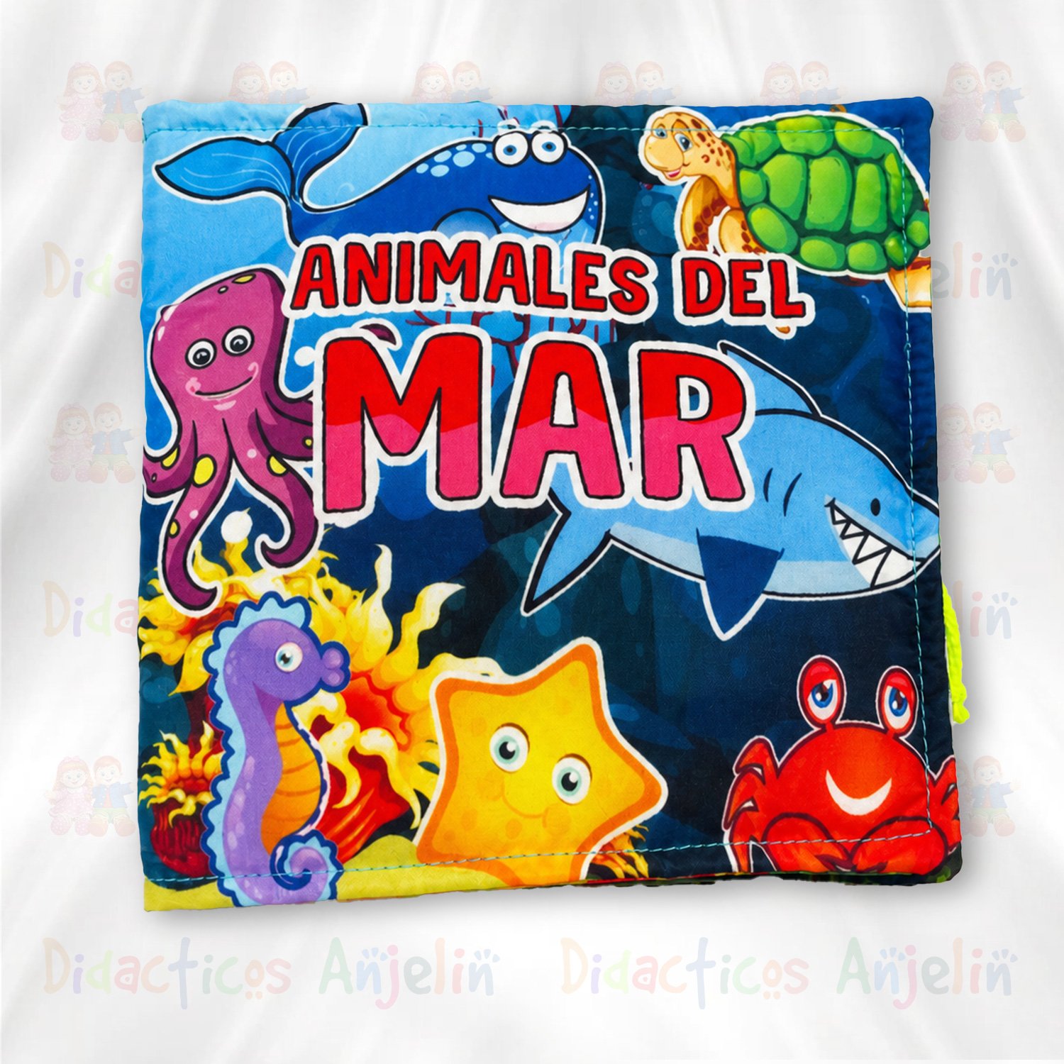 Libro didáctico de tela para bebés “Animales del Mar”, con ilustraciones coloridas de pulpo, ballena, tiburón, tortuga, caballito de mar y estrella marina sobre fondo oceánico.
